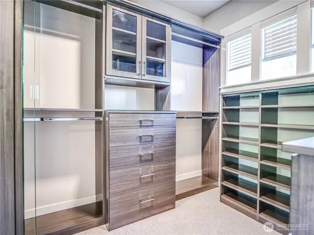 Primary walk-in closet with new custom closetware