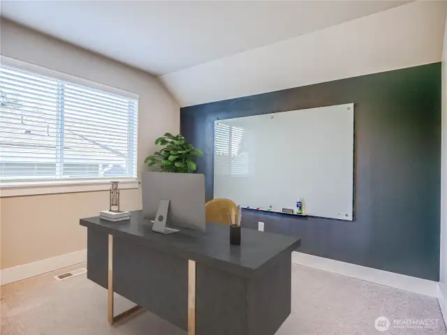 5th Room on upper floor has been set up to accomodate office study as white board and custom paint creates a working wall.