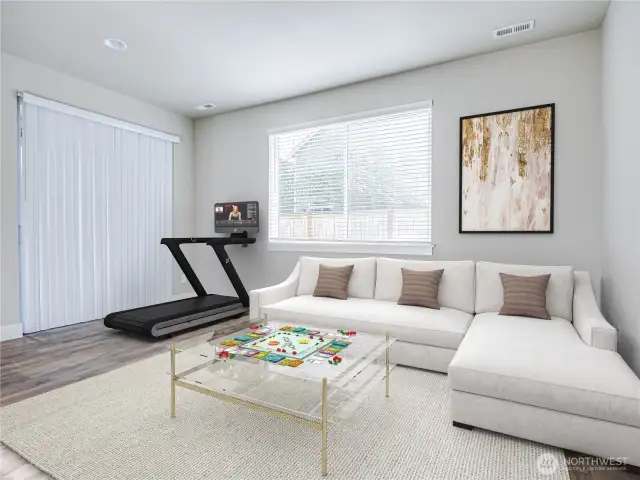 There is a true suite of rooms on the entry level. A living are/recreation room with slider going out to backyard and covered patio. This interior entry level has LVP flooring