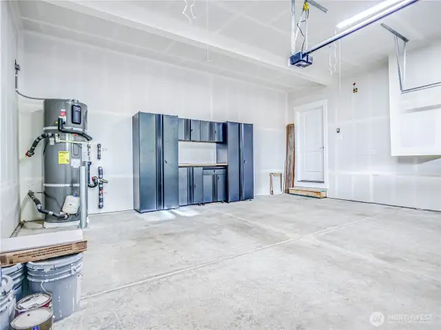 Garage has storage and workshop table. Water heater is the garage. The furnace is in a closet on the entry level under the stairs and the home has central A/C