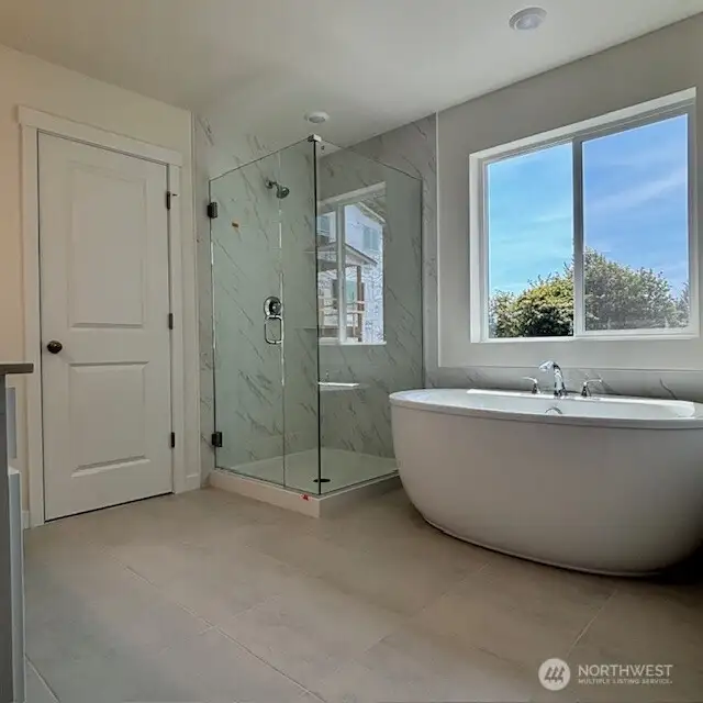 Spa-style freestanding tub in Primary Bath.