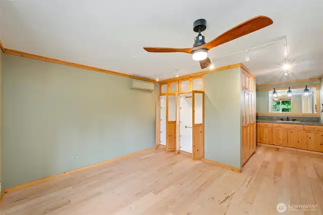 The master bedroom is on the main floor, to the left of the kitchen. It includes lots of closet space and a spa-like en-suite.