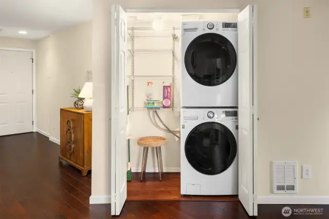 Convenient hall laundry with plenty of storage.
