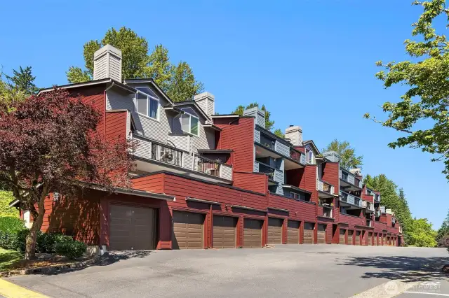View of the H complex which contains this unit. H106 comes with a garage directly below the unit/deck and another parking space #149. It's the fourth garage to the left of the last stairway. There is also visitor parking across from the garage.
