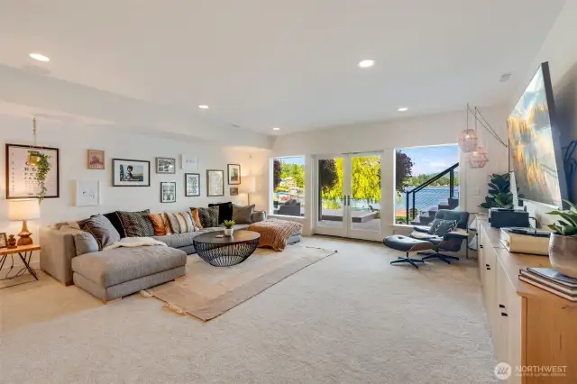 Large downstairs media room with built in surround sound speakers!