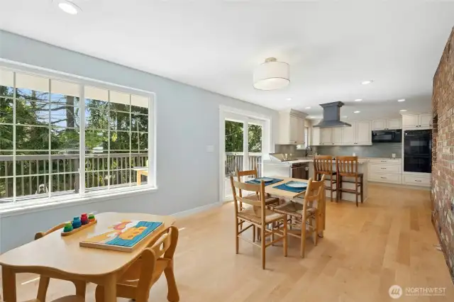 Natural light pours in through large windows and glass doors that open to a sunny deck overlooking the lush backyard ,perfect for al fresco dining and summer gatherings.
