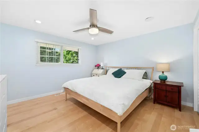 The primary bedroom with window to the backyard.