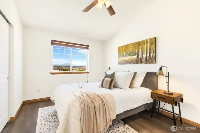 Spacious primary bedroom with a beautiful view!