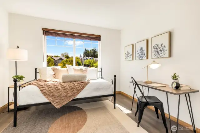 Second bedroom with a huge window looking out to the playground and up the street.