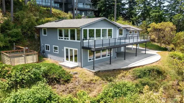 Garden area easily accessible from lower level family room. Park under the deck and access the home through french doors or the side door on the garage.