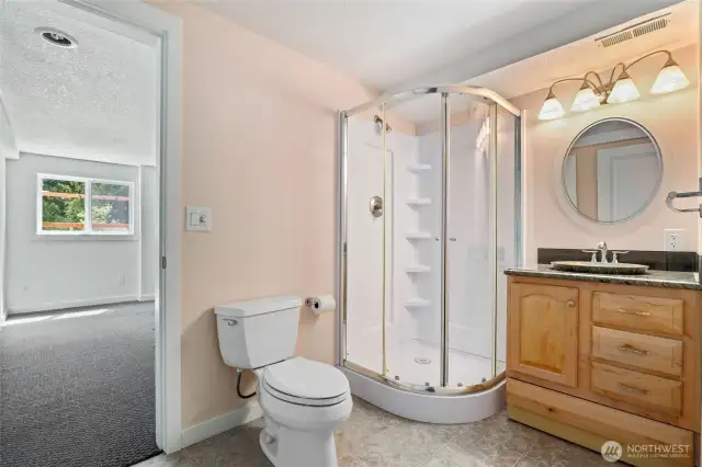 Lower Level 3/4 Bath with access to the bedroom and garage.