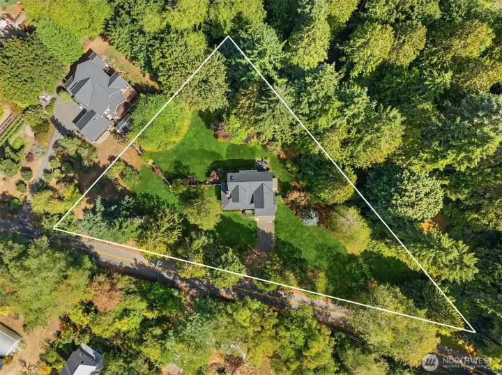 The lot extends to the south affording yet another level lawn area (point of the pizza slice in the photo is the southern property line.