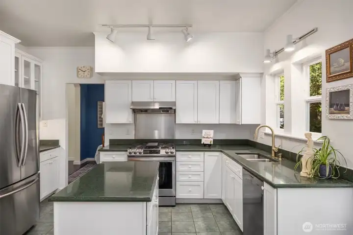 Light and bright kitchen with newer stainless steel appliances