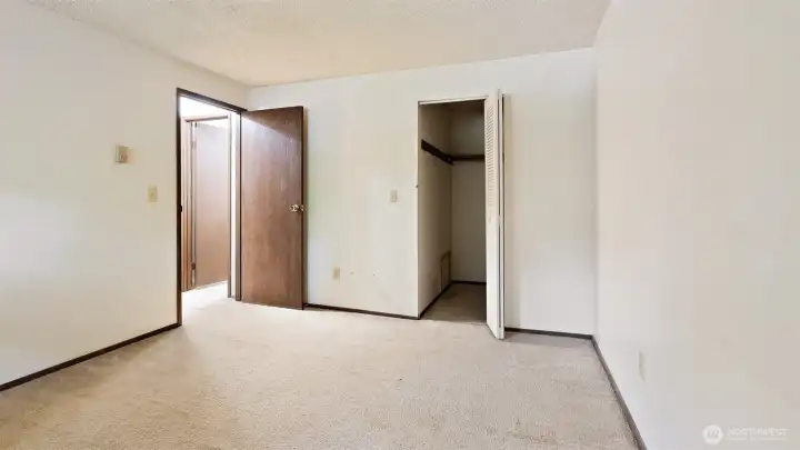 Primary Bedroom W/Walk In Closet + Place For Washer and Dryer.