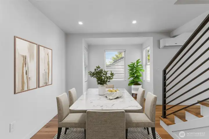 Open-concept flow perfect for both everyday dining and festive gatherings. Virtually staged.