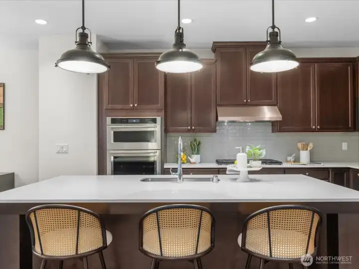 Large quartz island with space for seating.