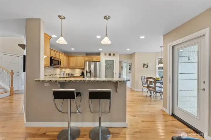 Eating Bar with Door to Extended Deck and Fenced backyard