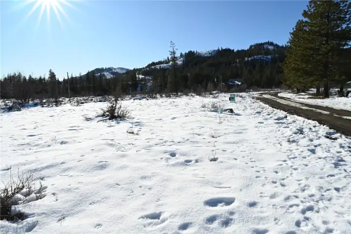 Looking towards Sun Mtn, with Green Meadows Dr. on the right, the water hook up area in front of the Mountain To River Realty sign.
