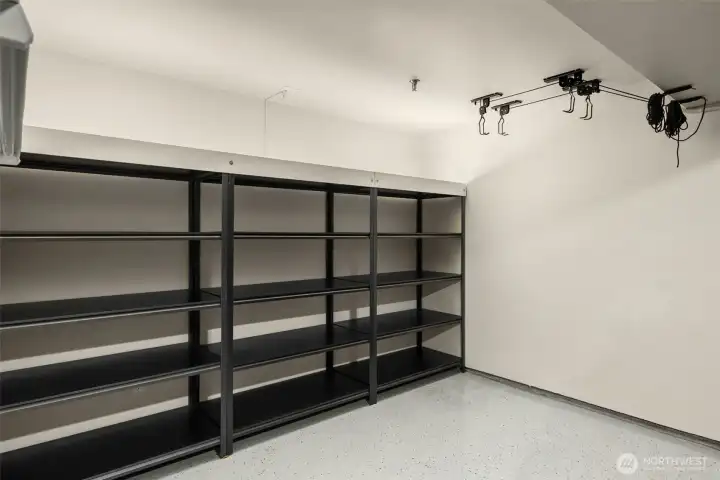 finished 2-car garage goes beyond parking—complete with epoxy floors & built-in storage