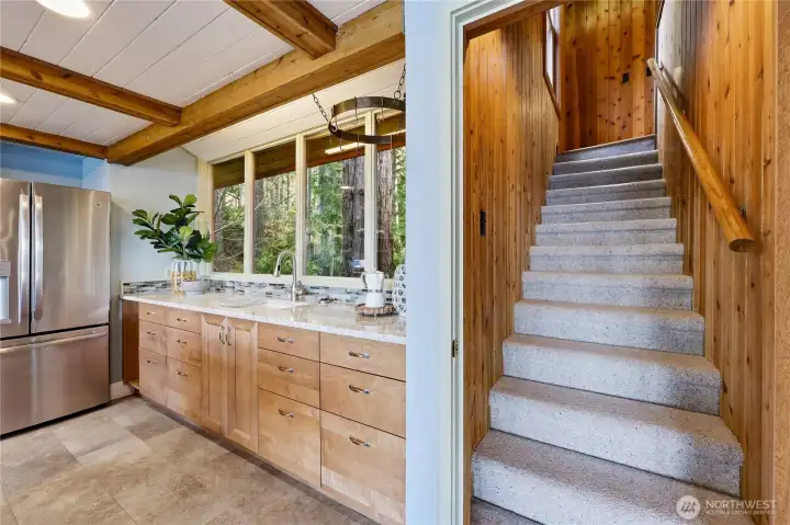 Garden sink with views out to the front of the house and the back staricase that leads up to the main bedroom.