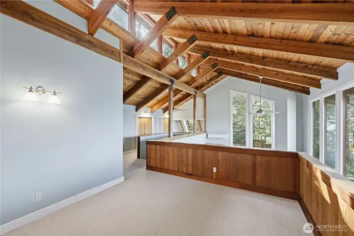 Loft space looks over living room and connects to main bedroom.
