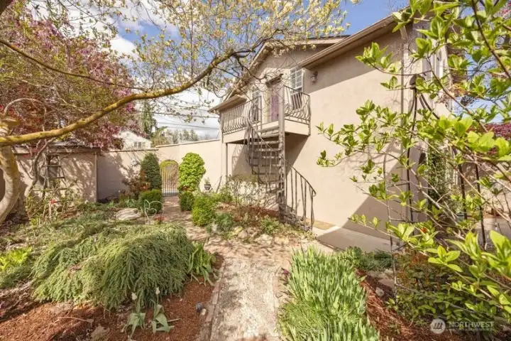 BACKYARD WITH STAIRWAY TO STUDIO ABOVE THE GARAGE