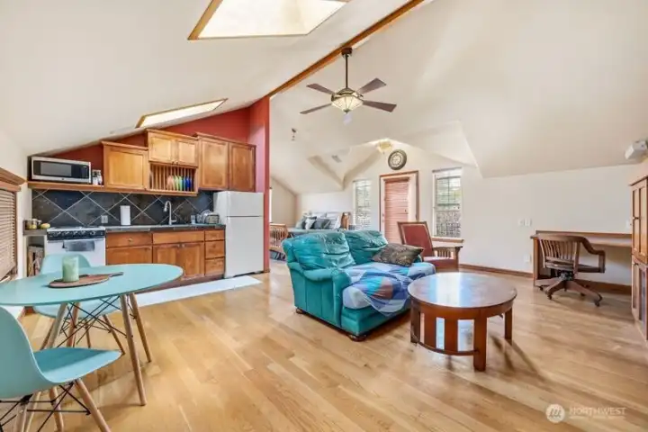 STUDIO WITH KITCHEN AND CHERRY CABINETS