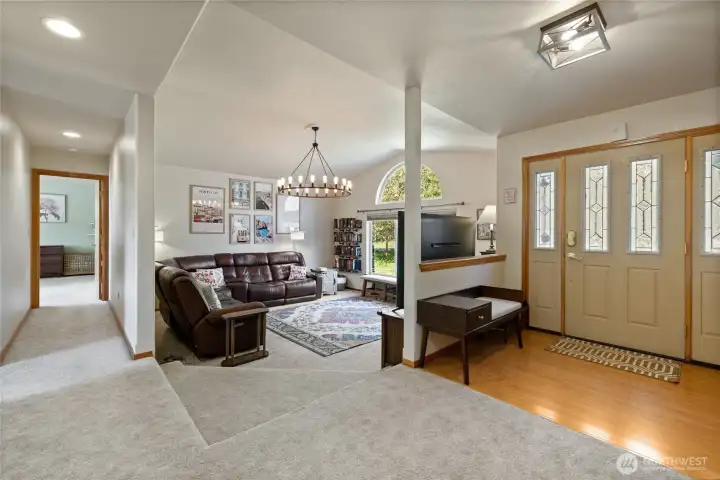Foyer entry to main level and living room.