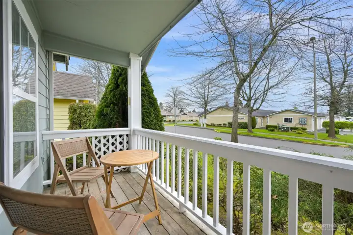 Inviting front porch to greet neighbors and tovenjoy sunny days.