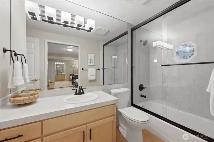 Guest bath is ensuite to 2nd bedroom or accessible via hallway