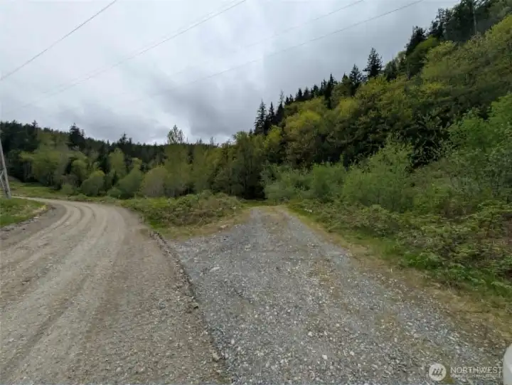 The road to the right is the access road, park here and walk up.