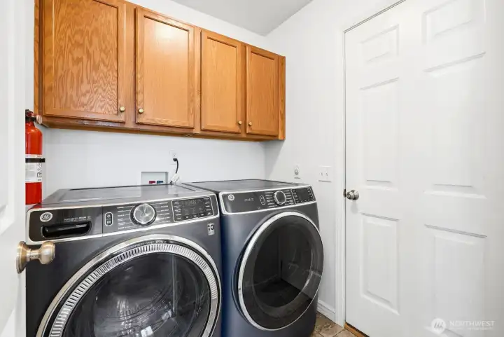 Laundry room off of kitchen and garage entry Laundry room off of kitchen and garage entry