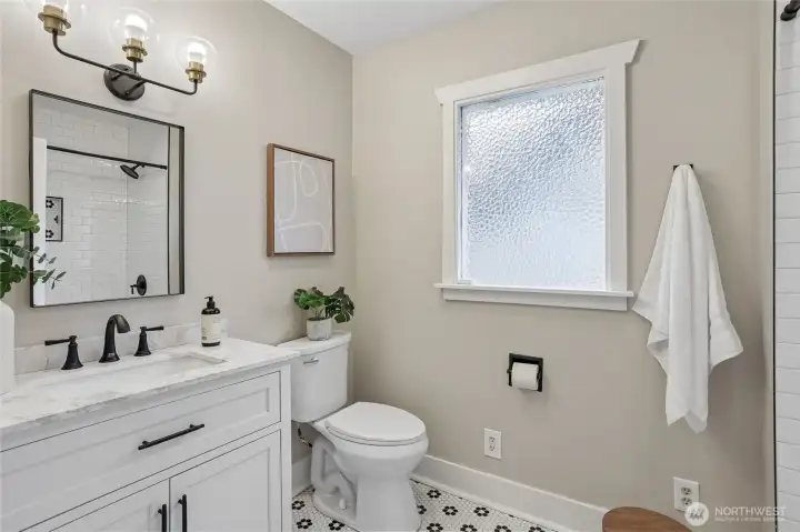 Stylishly fully updated bath with timeless finishes—quartz countertops, classic tile, and matte black fixtures create a clean, modern feel. Bright, fresh, and thoughtfully designed, it’s a space that feels both elevated and effortlessly livable. Stylishly fully updated bath with timeless finishes—quartz countertops, classic tile, and matte black fixtures create a clean, modern feel. Bright, fresh, and thoughtfully designed, it’s a space that feels both elevated and effortlessly livable.