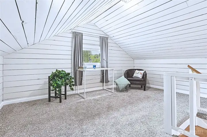 A warm and welcoming attic sanctuary is ready for you—accessible via a delightful staircase and beautifully rejuvenated with fresh paint, luxurious new carpeting, and updated padding. The bright whitewashed wood paneling accentuates the space's original charm while providing a fresh, adaptable area ideal for a bedroom, office, or creative studio. A warm and welcoming attic sanctuary is ready for you—accessible via a delightful staircase and beautifully rejuvenated with fresh paint, luxurious new carpeting, and updated padding. The bright whitewashed wood paneling accentuates the space's original charm while providing a fresh, adaptable area ideal for a bedroom, office, or creative studio.