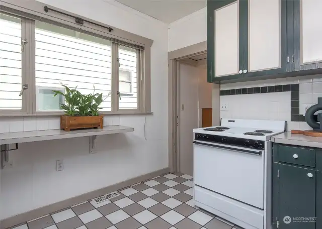 Kitchen offers eating space, additional prep space or morning sun for your indoor herbs. Door leads to private entrance for lower level potential income.