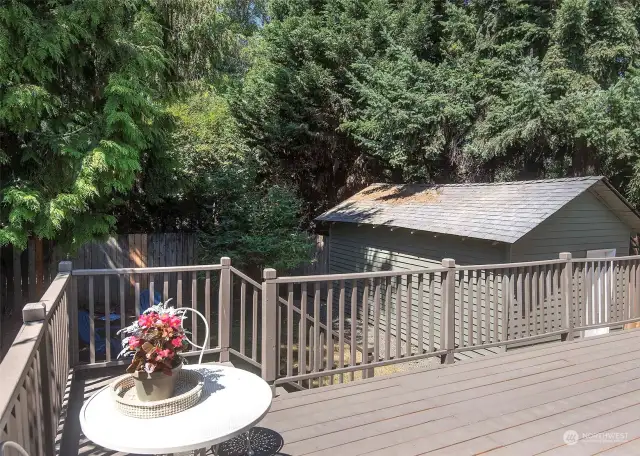 Over looking the deck, yard and detached garage accessed via alley way.