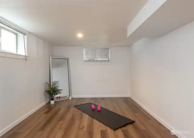 One of two lower level bedrooms or space for yoga with a friend! Bright home office?