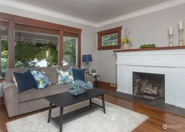 Large windows over looking your Craftsman style front porch. Mature landscaping ads privacy and peace.