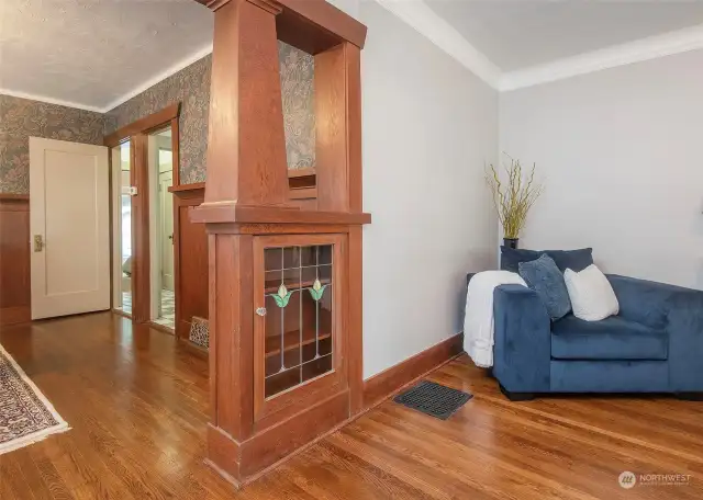 Gorgeous built-ins and stained glass coverings capture this home's charm and character.