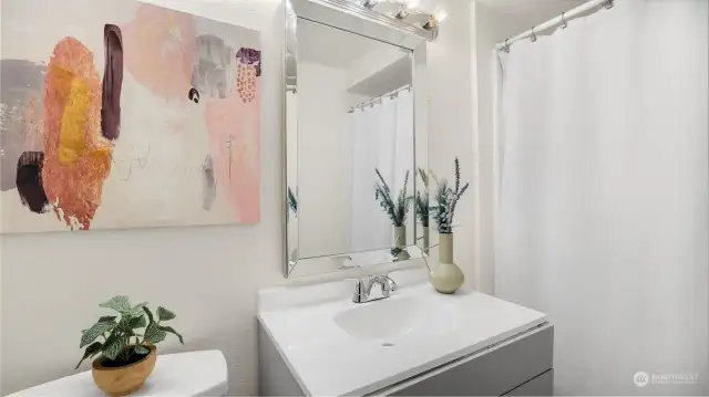 Bright and functional full bathroom on the main level, offering comfort and convenience