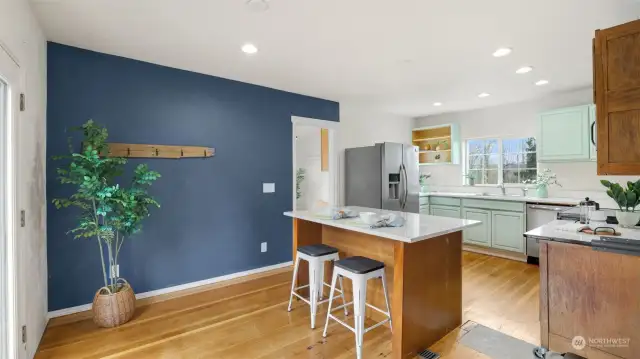 Spacious open kitchen with abundant natural light, creating a warm and inviting space.