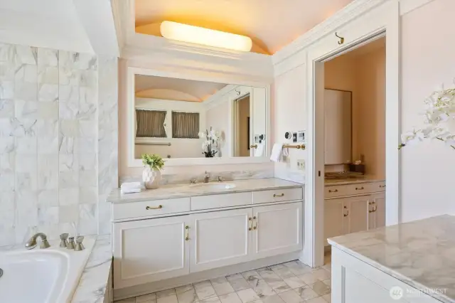 One of the TWO ensuite bathrooms in the primary bedroom. Soaking tub and walk-in shower. Separate vanity and of course a walk-in closet.