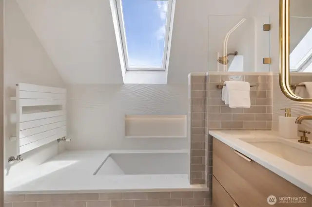 One of the two top floor bathrooms. Remodeled with Brizo fixtures, specialty lighting, heated floors and custom floating vanity.