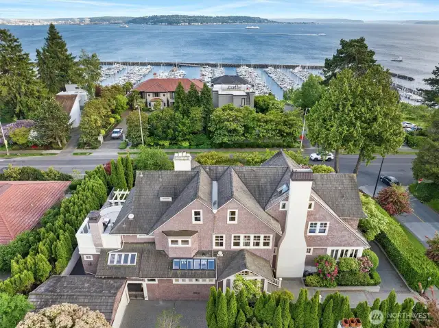 Looking from the back of the house- notice the two car garage, a long driveway for basketball, trikes, or another car. Also-- to the right, you can see the oversized parking pad too.