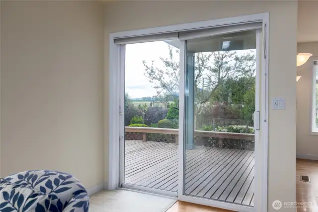 Sliding glass door goes out to a covered deck, beautiful views of the farms in LaConner