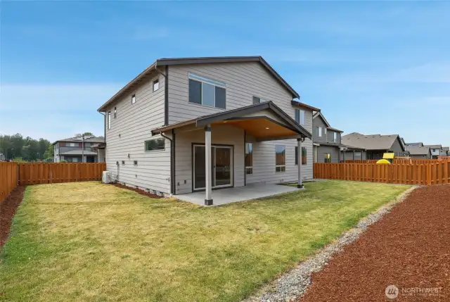 Covered patio with fully fenced corner lot.