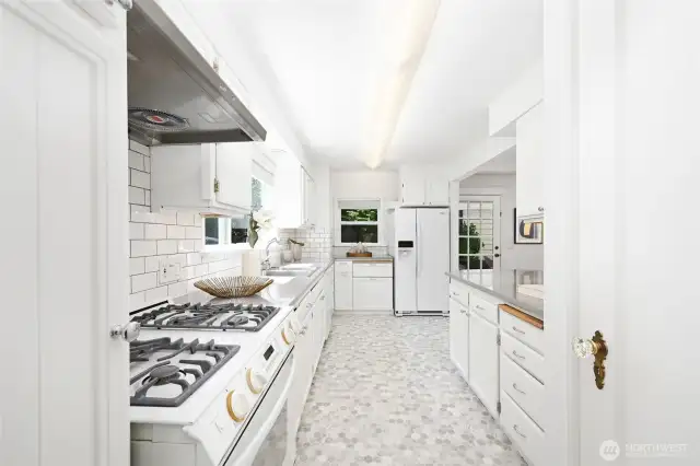 The updated kitchen opens to a family room that leads directly to the back patio and is part of the circular floor plan.
