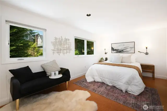 The upstairs is a lovely retreat boasting a large primary bedroom