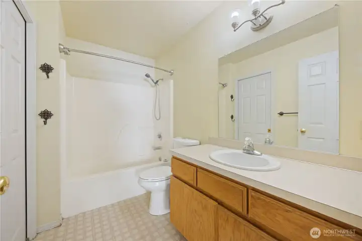 Bathroom with pocket door to Primary Bedroom