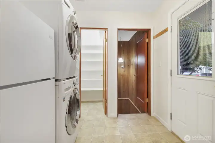 Upper laundry room and stairwell to basement. . .